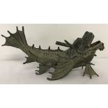 A bronze figurine of a Chinese Dragon fish.