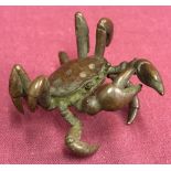 A small Chinese bronze figure of a crab, signed to underside.