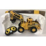 A boxed remote control 1:10 scale construction vehicle.