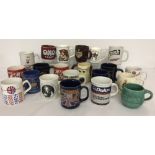 A box of collectors and advertising mugs.