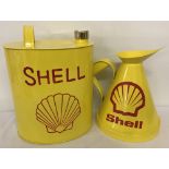 2 Shell oil cans painted yellow with red detail.
