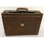 A Texier brown leather briefcase.