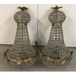 A pair of heavily beaded hanging chandelier style lampshades.