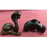 2 carved dark wood Japanese netsukes. A snake together with a shark, both signed.