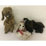 3 vintage soft toy pyjama cases in the form of dogs, with zip up compartments.