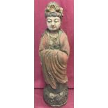 A painted wooden figurine of an Oriental deity.