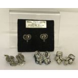 A pair of vintage silver screw back earrings set with Marcasite's stones.