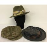 A green felt ladies hat with 24 pin badges relating to Hunts, Field sports and pony clubs.