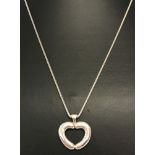 A boxed 'Tomfoolery' silvery contemporary style heart necklace by Theo Fennell.
