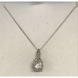 A boxed Diamonite pendant set in white gold.