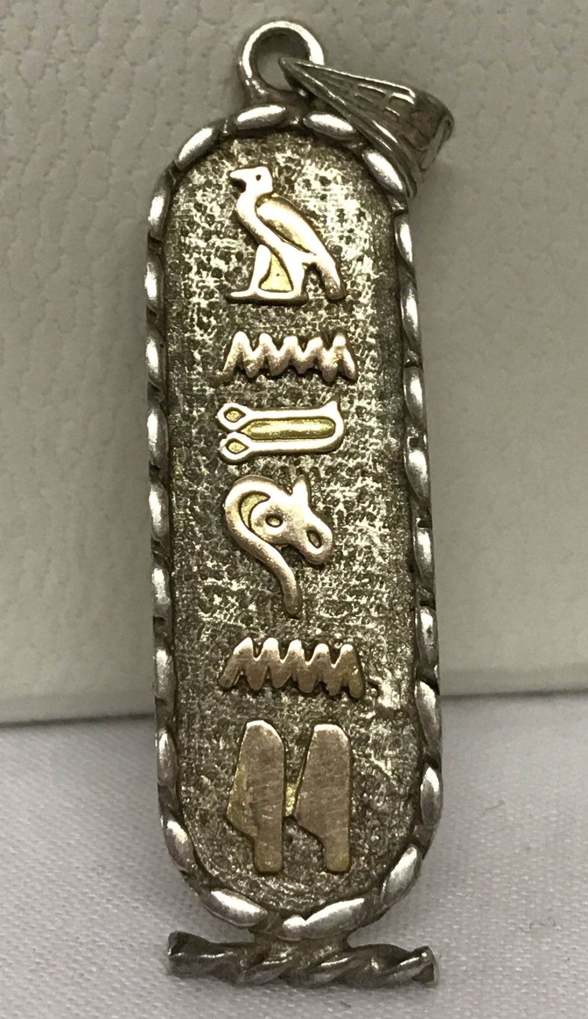 A vintage hieroglyph tablet style pendant. Marked 925 to back. Approx. 5cm long.
