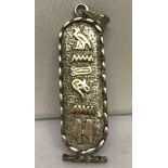 A vintage hieroglyph tablet style pendant. Marked 925 to back. Approx. 5cm long.