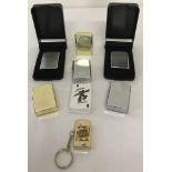 A collection of 8 unused windproof lighters, mostly by Ronson.