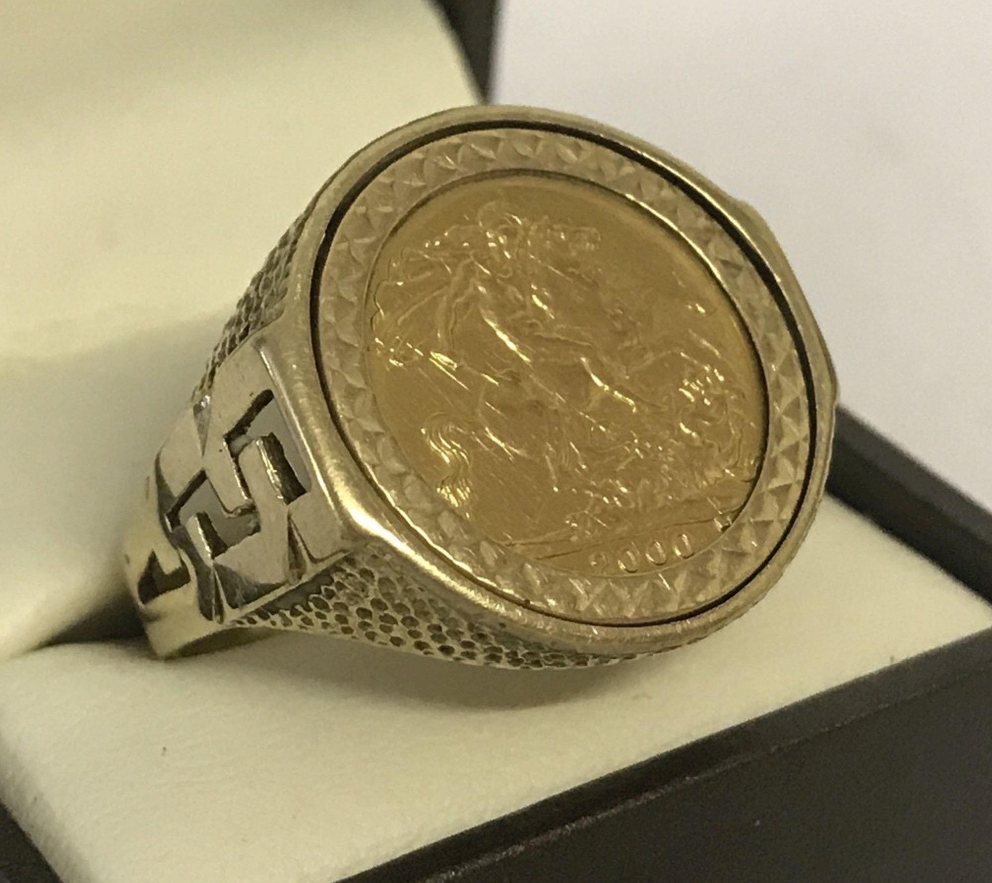 An Elizabeth II half sovereign, dated 2000, set in a 9ct gold mounted men's ring.