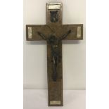 A vintage wooden wall hanging crucifix.