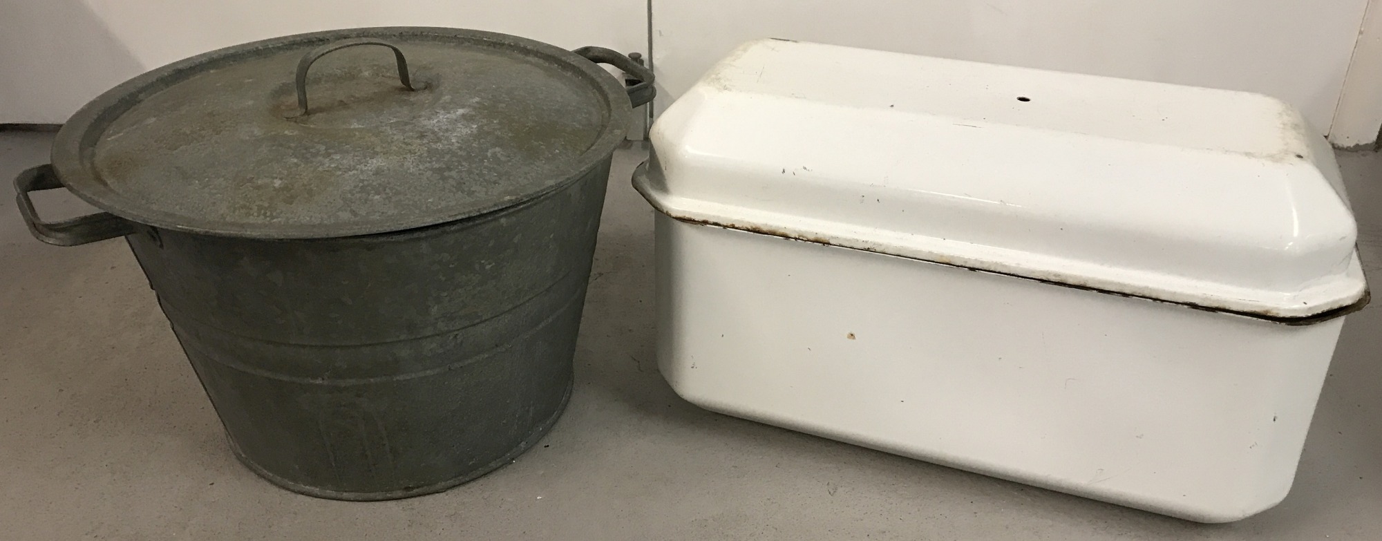 A vintage galvanised lidded pail with drainage platform insert to interior.