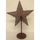 A modern battery operated light up star ornament.