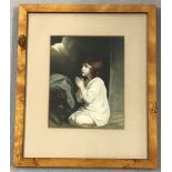 A framed & glazed vintage print of a young girl in prayer.