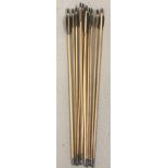 A set of 12 handmade wooden, steel-tipped 26.5"arrows. With black fletchings.