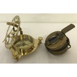 2 ornamental brass compasses. One marked "TG Co Ltd, London, N A266322".