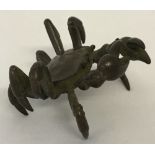 A small Chinese bronze figure of a crab, signed to underside.