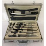 An aluminium cased set of Prima professional kitchen knives.
