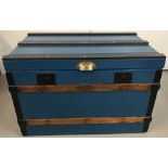 A large 2 handled wooden linen chest painted blue, with metal banded edges and brass handle.