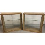 A pair of Ikea wooden display cabinets.