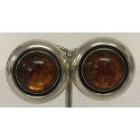 A pair of vintage amber and Danish silver, circular clip on earrings by designer Niels Erik From.