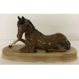 A Beswick ceramic horse figurine "Spirit of Peace" on ceramic plinth.