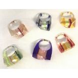 6 vintage funky design plastic rings in varying colours. Striped detailing to each ring.