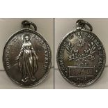 An antique silver medallion Hallmarked Birmingham 1908.