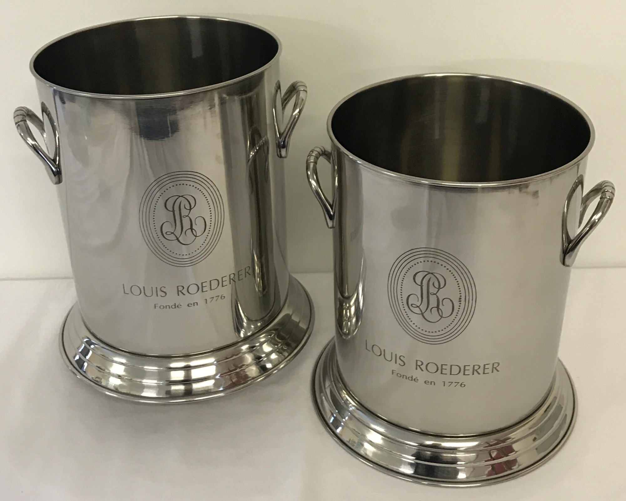 A pair of 2 handled Louis Roederer champagne coolers with engraved detail to front.