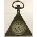 A small brass cased, triangular shaped pocket watch with Masonic style decoration.