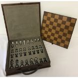 A fine quality leather cased chess set.