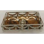 A small silver plated tray with galleried sides and faux tortoiseshell base.