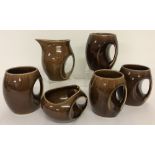 A set of 4 Holkham Pottery Owl mugs together with matching milk jug & sugar bowl.