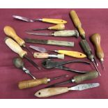 A tray of small vintage tools, mostly wooden handled.