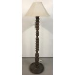 A vintage wooden barley twist standard lamp.