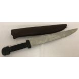 A machete style steel bladed knife.