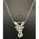 An Art Nouveau style 3 dimensional fairy pendant on a silver 18" fine curb chain.