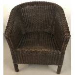 A Lloyd Loom style brown wicker chair.