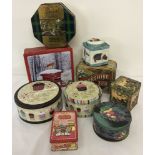 A box of assorted collectors tins.