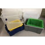 A collection of 10 assorted plastic tubs of various sizes.