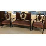 A Victorian 2 seater wooden framed settee with 2 matching arm chairs.
