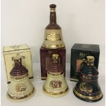 A collection of 4 Wade ceramic Bells whisky bell shaped decanters (empty).