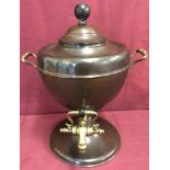 A vintage copper samovar with brass handles and tap and wooden finial.