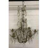 A vintage brass and crystal 6 arm chandelier.