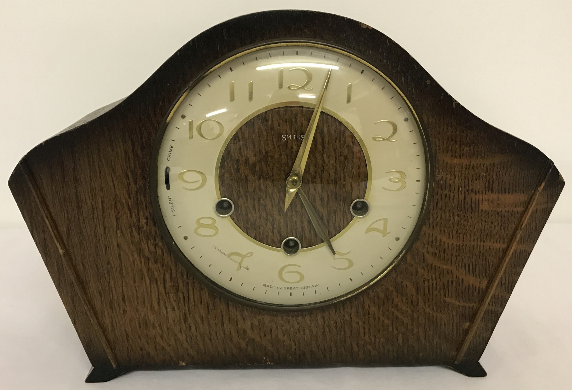 A vintage Smiths mantel clock with wooden case.