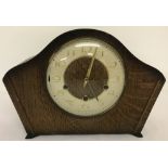 A vintage Smiths mantel clock with wooden case.